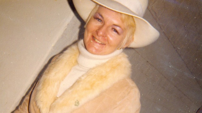 Shirley Finn wearing a hat and fur trimmed coat