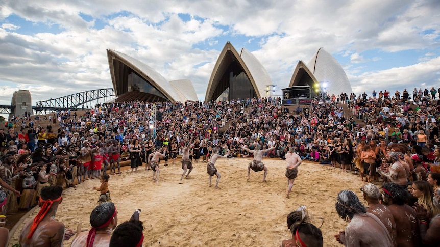Traditional dancers entertain the crowd at the Sydney Opera House