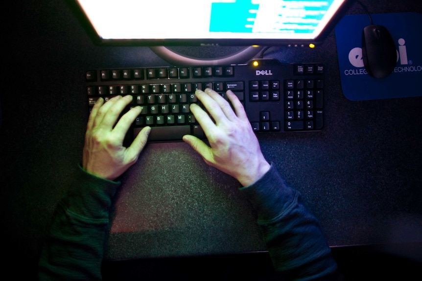 U.S. Marine Sergeant Michael Kidd works on a computer at ECPI University in Virginia Beach, Virginia, February 7, 2012.