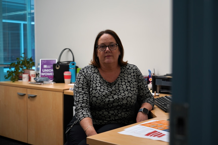 A woman at her desk in an office.