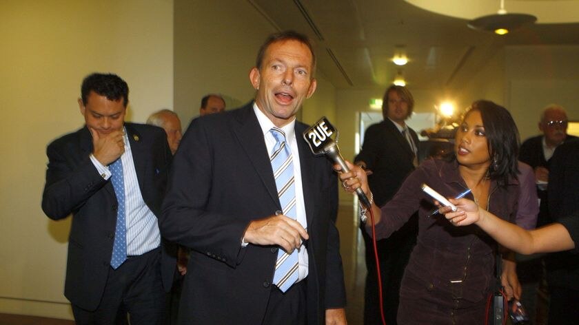 Tony Abbott walks through Parliament House