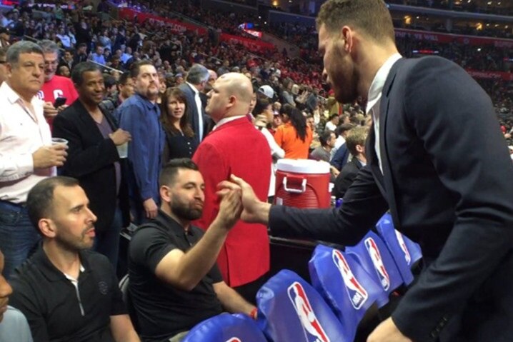 Clippers forward Blake Griffin high-fives assistant trainer Matias Testi