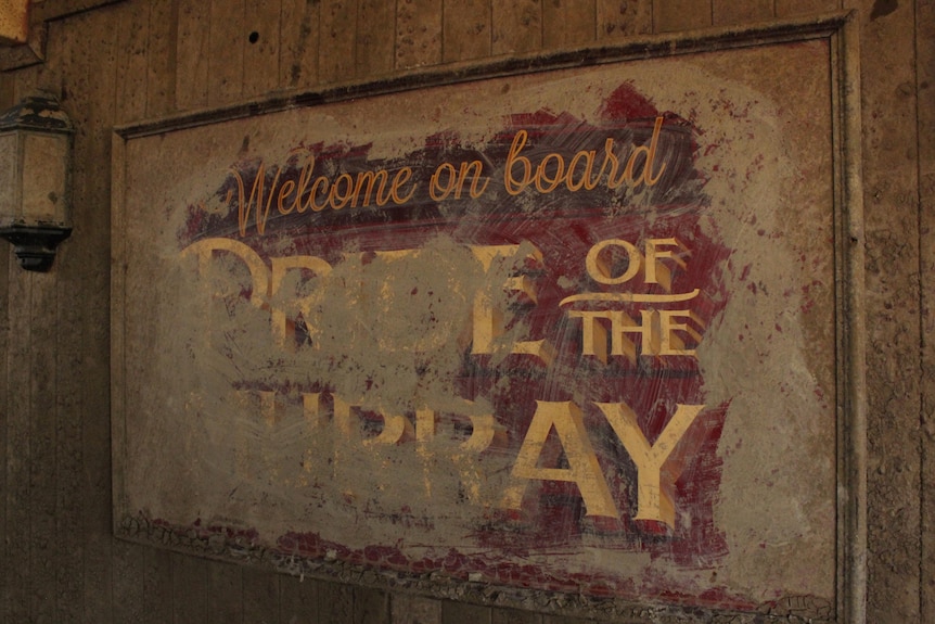 Faded sign saying Pride of the Murray.