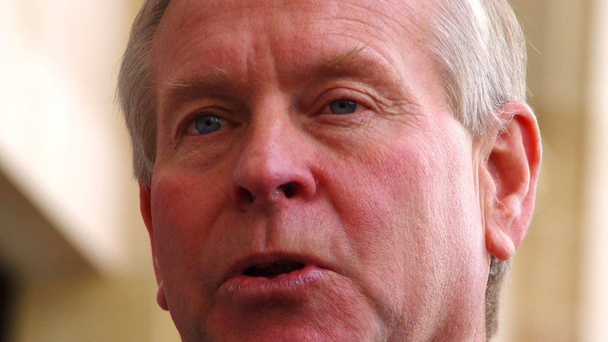 Close up of WA Premier Colin Barnett reacting to federal budget 2014