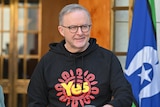 Anthony Albanese wearing a black hoodie with the "yes" logo on the front.