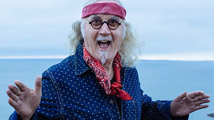 Billy Connolly smiling at the camera.