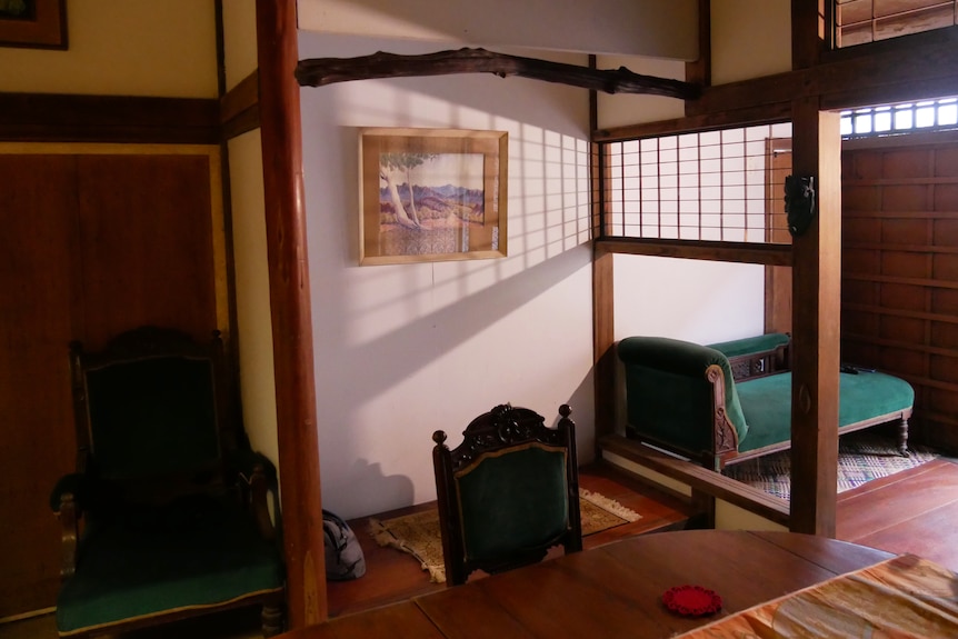 Light shines through wooden latticework in a Japanese room