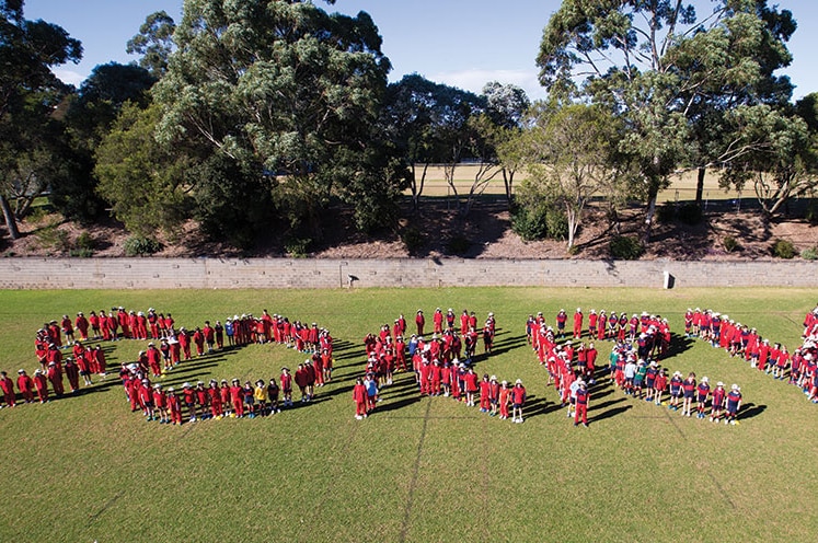 The Footprint group at Barker College spelling out the word sorry