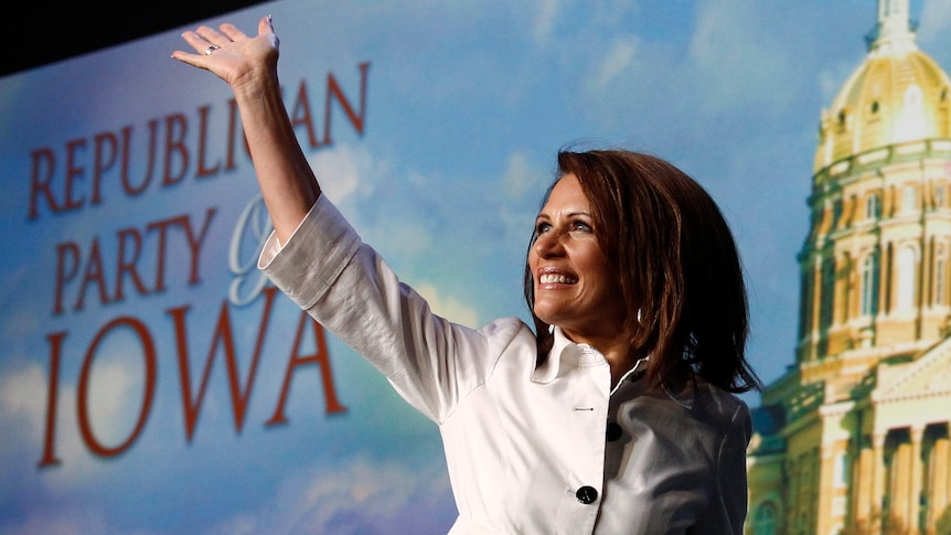 US Republican presidential candidate and Minnesota Congresswoman Michele Bachmann waves onstage at the Iowa Straw Poll