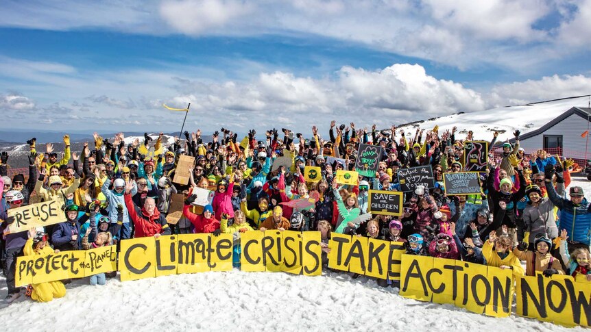 A group of about 100 protesters in the snow