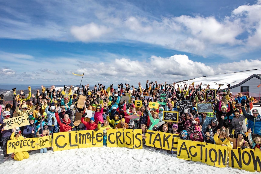 A group of about 100 protesters in the snow