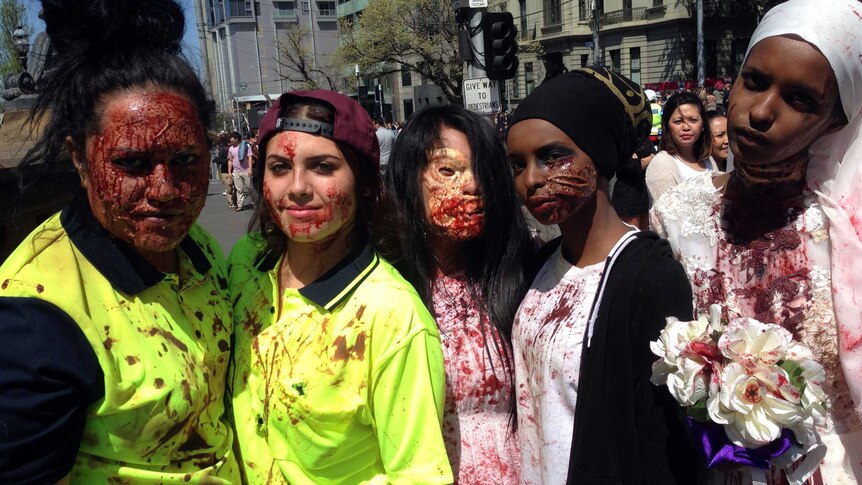 Five female zombies post for photos