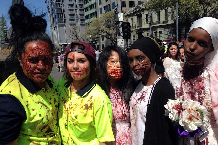 Five female zombies post for photos