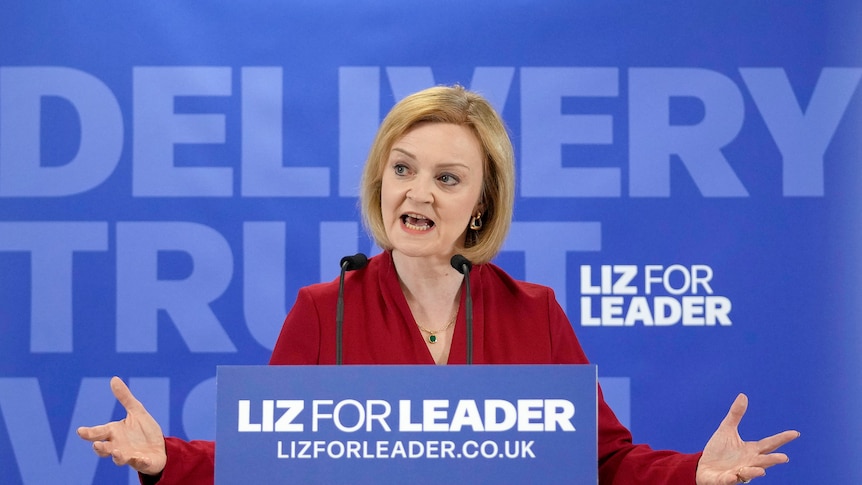 Liz speaks at a campaign event where a sign reads 'liz for leader'.