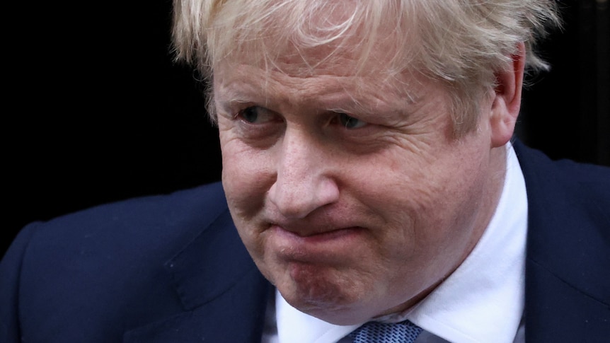 British Prime Minister Boris Johnson grimaces as he leaves Downing Street.