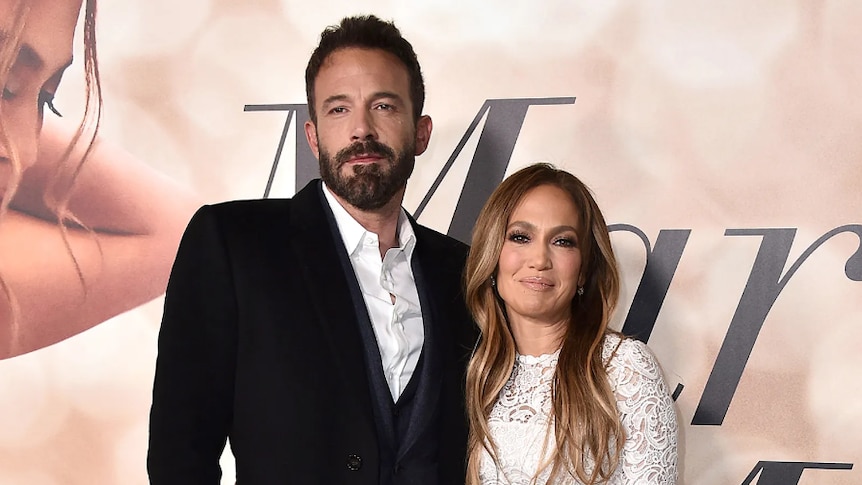 Ben Affleck and Jennifer Lopez posing to the camera,