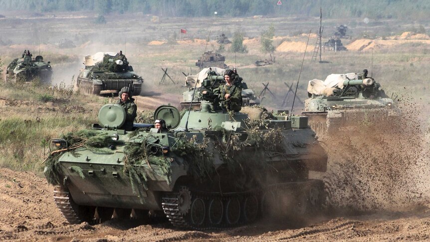 Belarusian army tanks drive preparing for war games at an undisclosed location in Belarus.