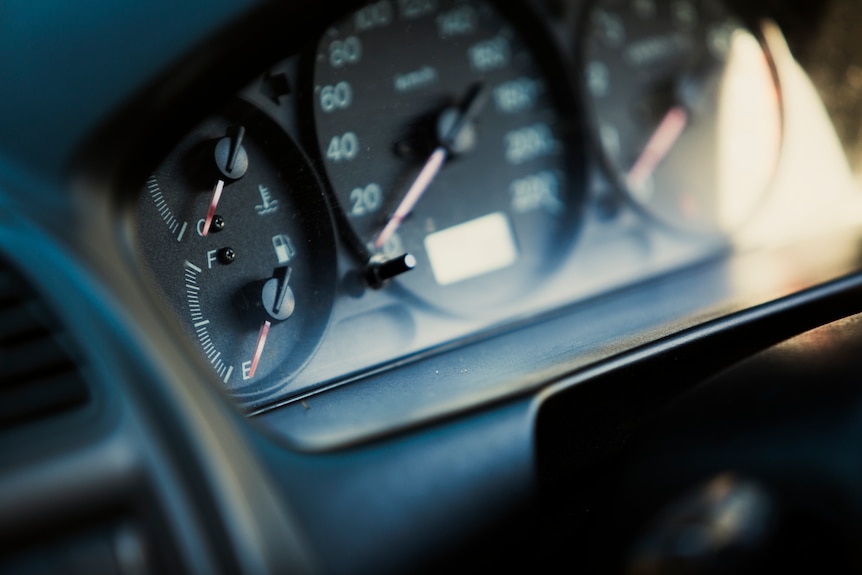 The fuel gauge shows the car's tank is empty.