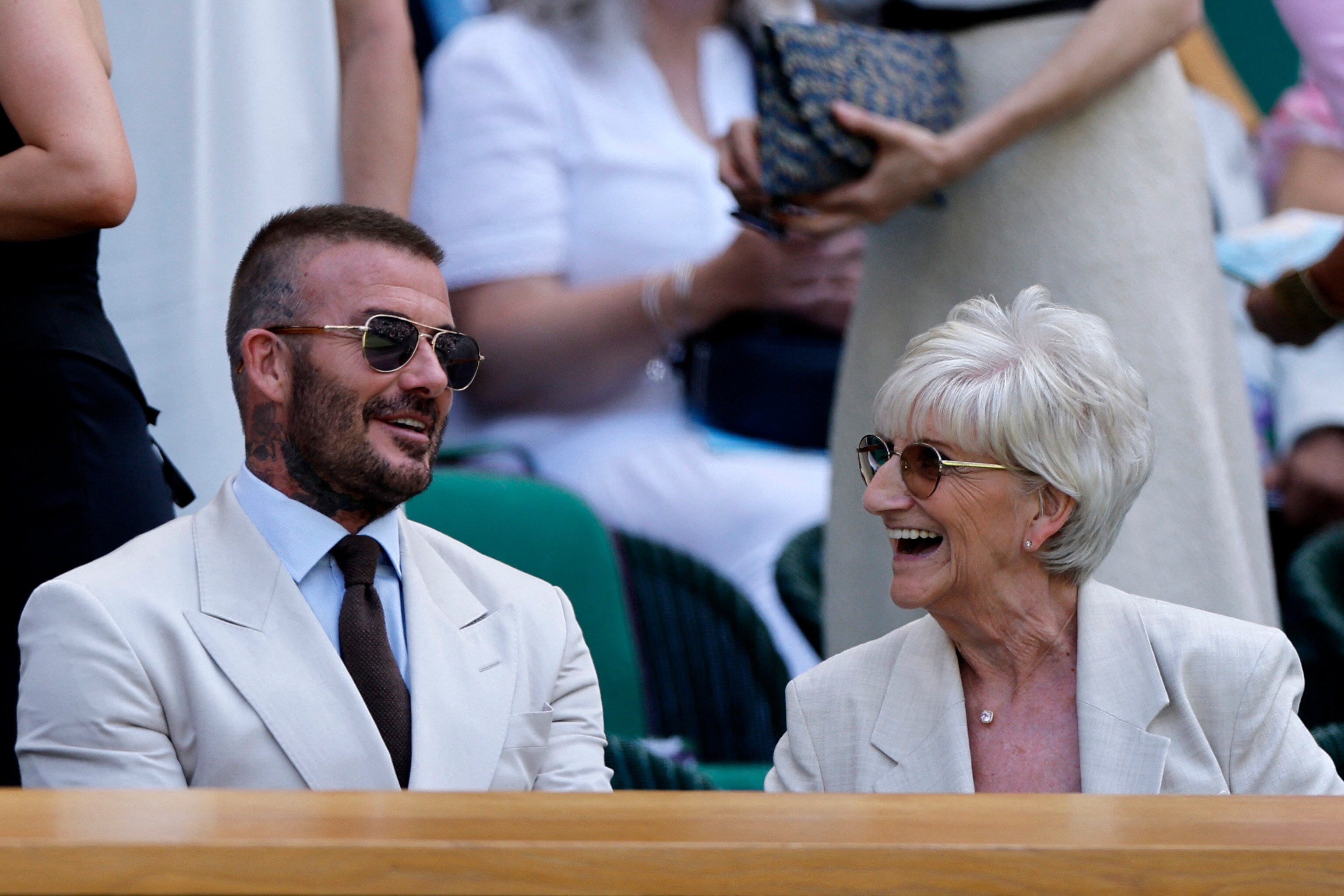 Footballer David Beckham and his mother Sandra, in matching cream blazers. 