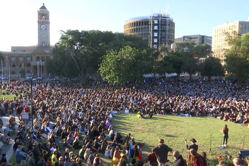 A very large crowd in a park