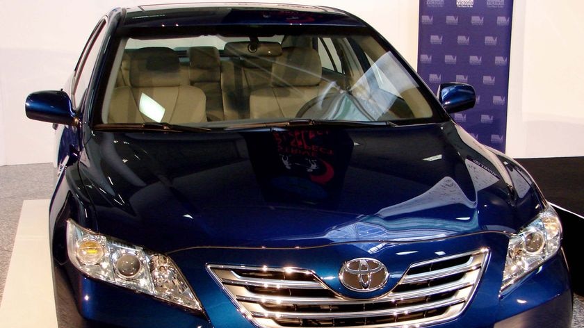 Toyota Camry hybrid on display.