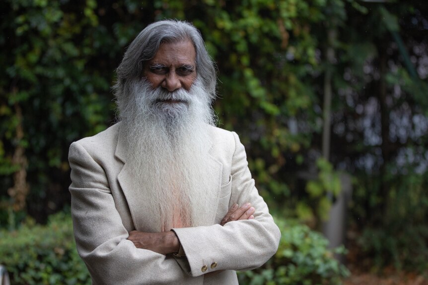 A man of Indian descent with a long white beard