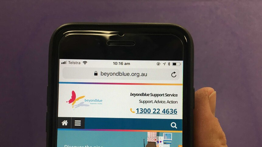 phone screen with beyond blue website