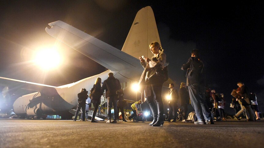Members of the media outside the C130 Hercules plane they are travelling on during the 2016 election campaign trail.