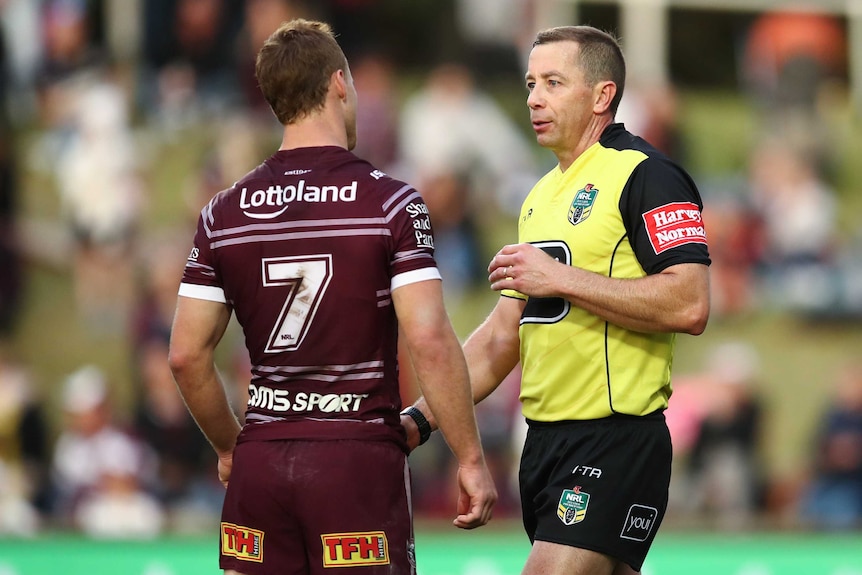 A Manly NRL player speaks with a referee during a match in 2018.