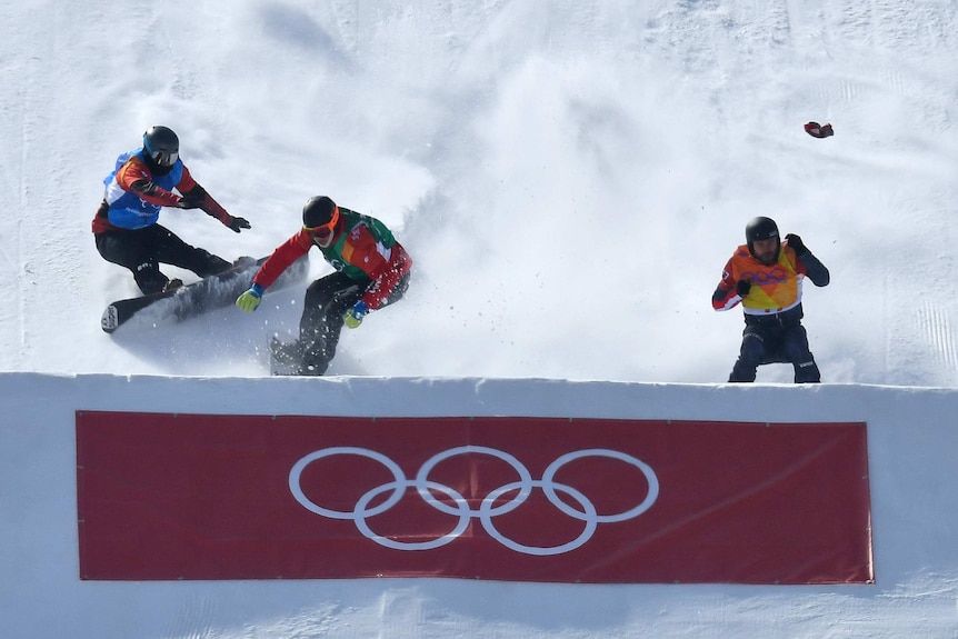 Kalle Koblet of Switzerland, Kevin Hill of Canada and Markus Schairer of Austria crash in Pyeongchang.