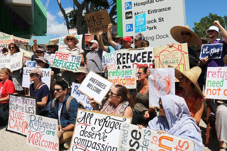 Protesters gather outside the Lady Cilento Hospital in Brisbane