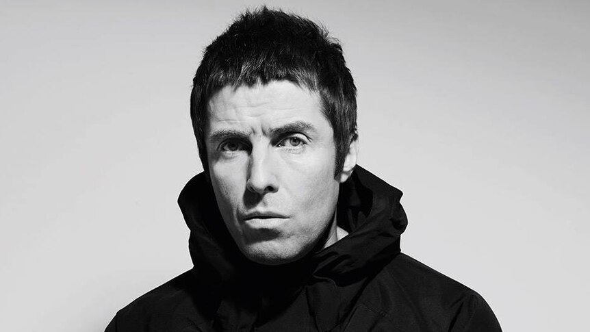 Liam Gallagher looks at the camera in a black jacket
