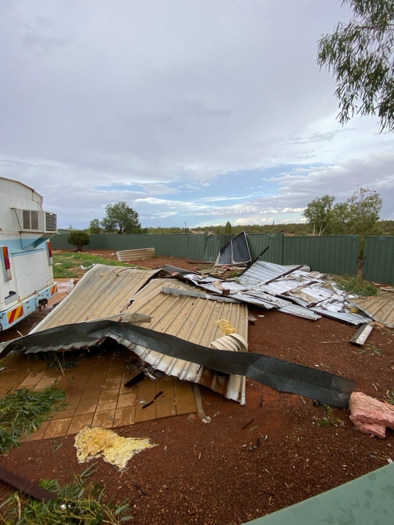 Piles of metal fencing next to a cararvon