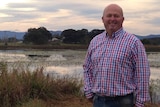 Independent candidate for Lyne, Brad Christensen standing near lagoon