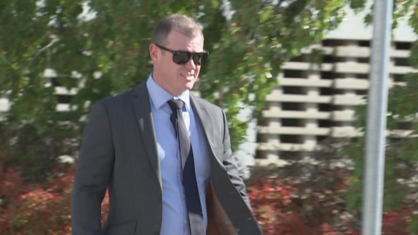 AFP officer Wade Joseph Howell walking to the ACT Magistrates Court