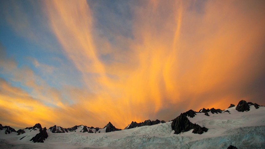 Clouds tower over the  Franz Josef Glacier on New Zealand's Southern Alps