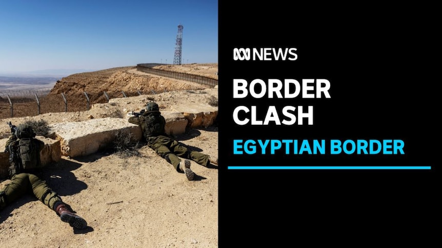 Border Clash, Egyptian Border: Two soliders lie prone against stone slabs looking over an arid valley. 
