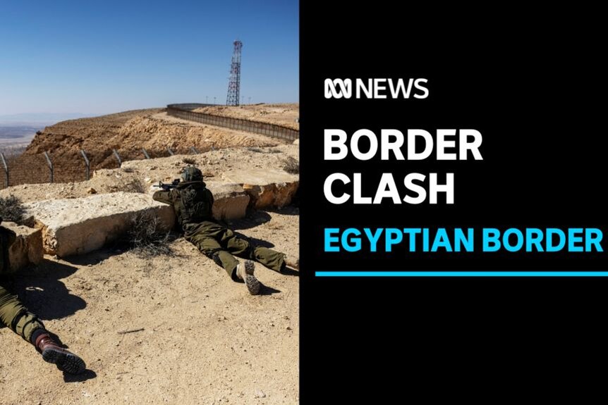 Border Clash, Egyptian Border: Two soliders lie prone against stone slabs looking over an arid valley. 