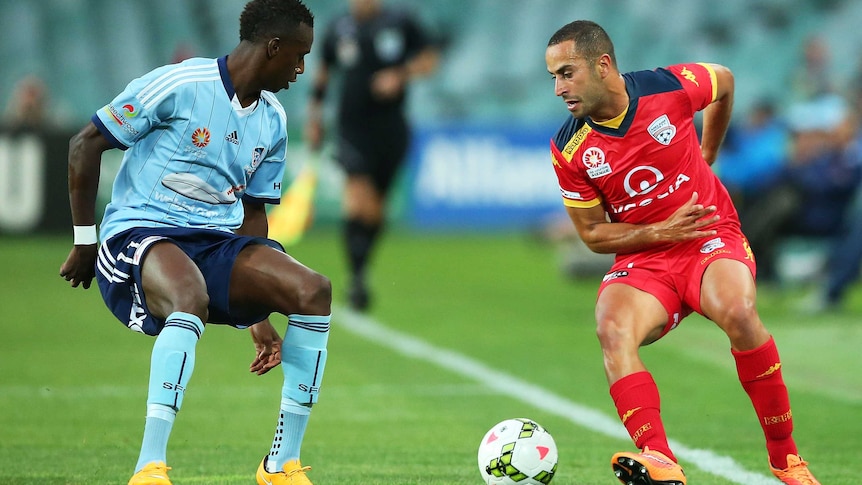 Tarek Elrich of Adelaide competes with Bernie Ibini of Sydney during the round 13 A-League match between Sydney FC and Adelaide United at Allianz Stadium