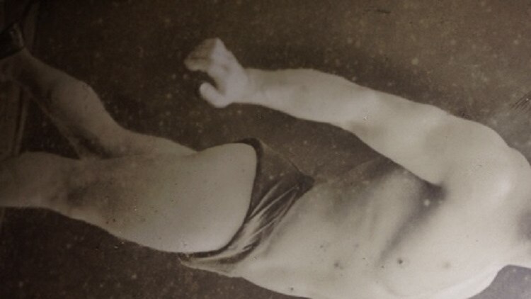 Black and white photo of Arthur Tilbury in a wrestler's pose