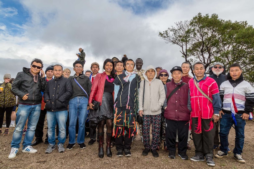 People of many cultures pose for a group photo at the traditional ceremony in the You Yangs.