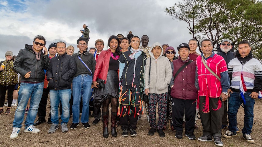 People of many cultures pose for a group photo at the traditional ceremony in the You Yangs.