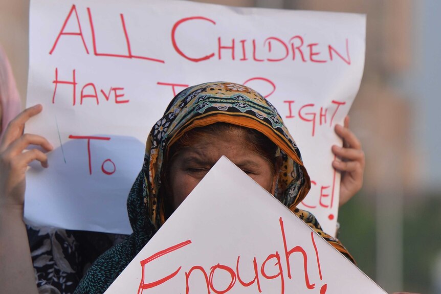 Pakistani rights activists protest against a child sex abuse