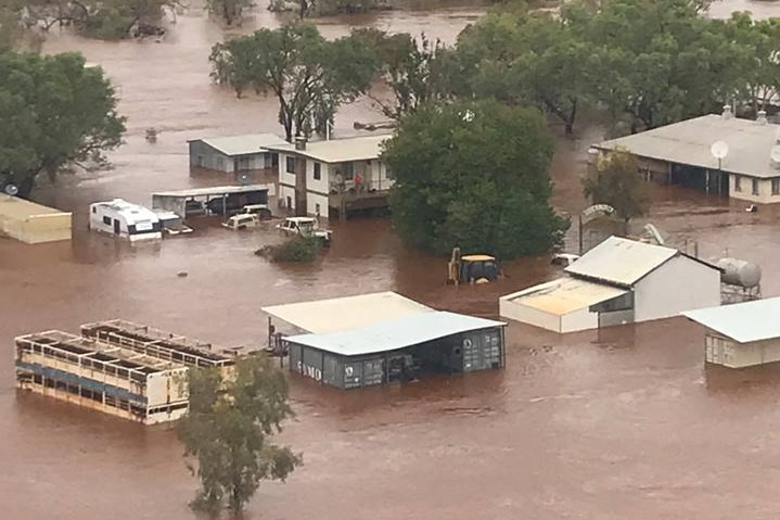 A vast cattle station submerged in water.