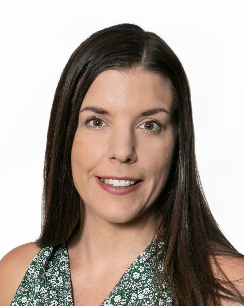 A woman with long hair against a white background.
