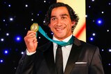 Johnathan Thurston poses with his fourth Dally M Medal