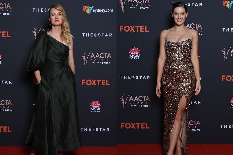 A side-by-side image of smiling women wearing a dark green dress and a sparkly gold dress.
