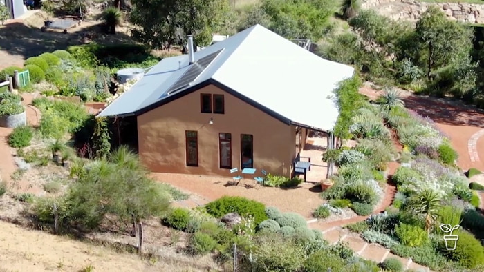 Aerial photo of strawbale house surrounded by gardens