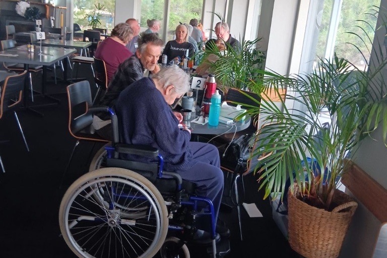 People sit at a hotel table.