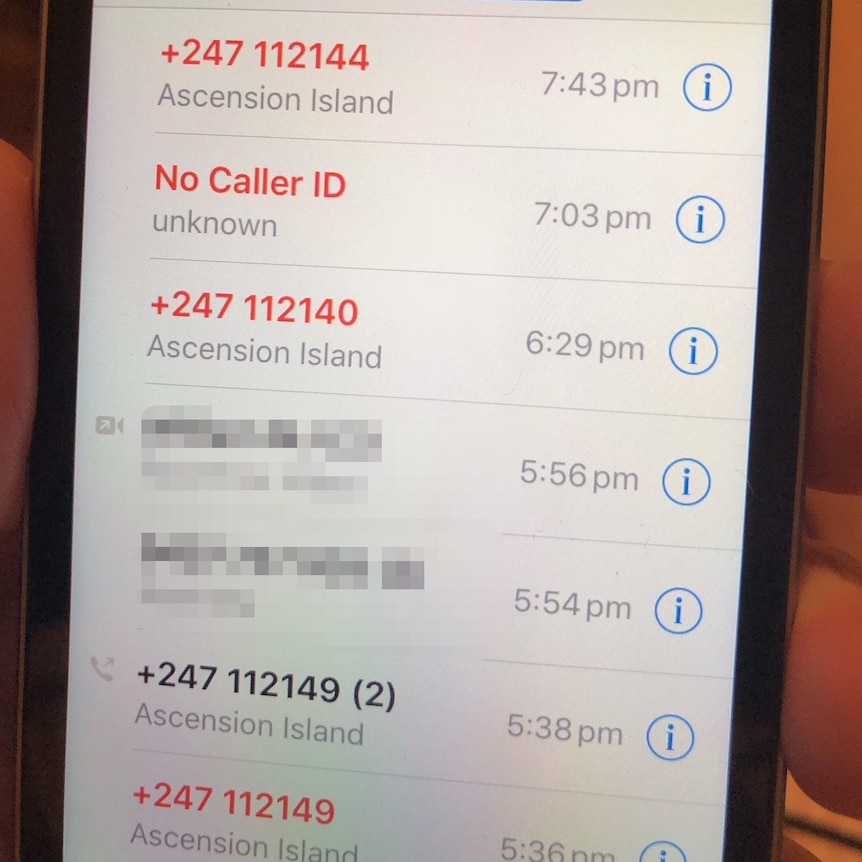 A mobile phone's missed call log listing a number of calls from the phone number in Ascension Island.